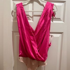 NWT.  Hot pink top / body suit bottom.  Size L